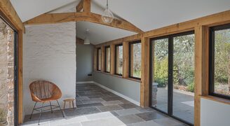 interior shot of a timber barn extension with exposed timber posts